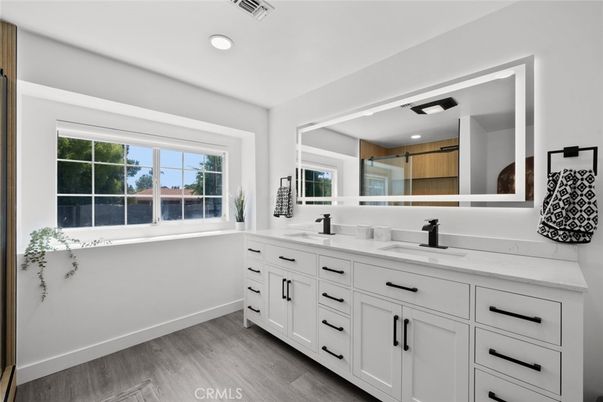 Bathroom, Dual Sink Vanities, Interior, Recessed Lighting, Wood Texture Flooring