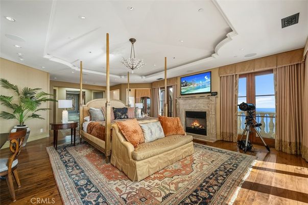 Bedroom, Chandelier, Fireplace, Fitness Equipment, Interior, Recessed Lighting, Wood Texture Flooring