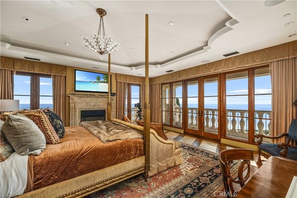Bedroom, Fireplace, Interior, Pendant Lights, Recessed Lighting, Water, Wood Texture Flooring