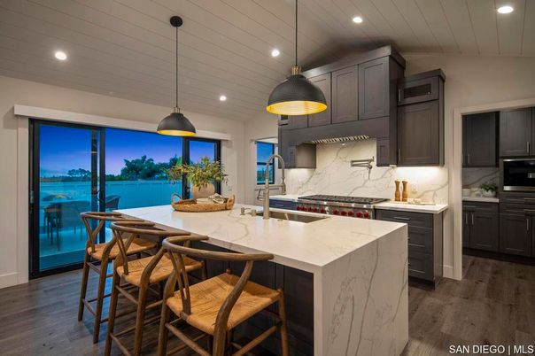 Interior, Kitchen, Marble Walls, Pendant Lights, Recessed Lighting, Stainless Steel Appliances, Wood Texture Flooring