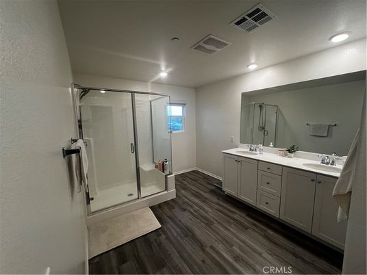 Bathroom, Dual Sink Vanities, Glass Shower, Interior, Recessed Lighting, Wood Texture Flooring