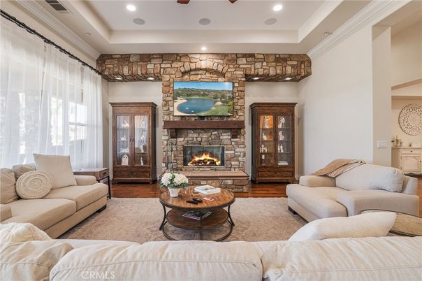Fireplace, Interior, Living room, Recessed Lighting, Stone Walls, Wood Texture Flooring