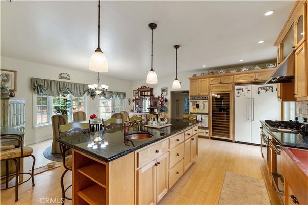 Chandelier, Dining room, Interior, Kitchen, Pendant Lights, Recessed Lighting, Stainless Steel Appliances, Wood Texture Flooring