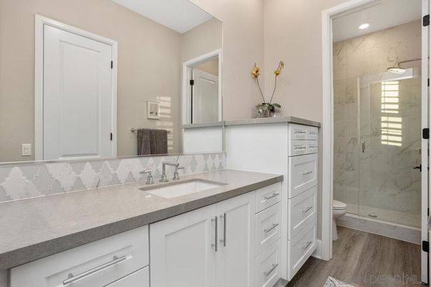 Bathroom, Glass Shower, Interior, Marble Walls, Recessed Lighting, Wood Texture Flooring