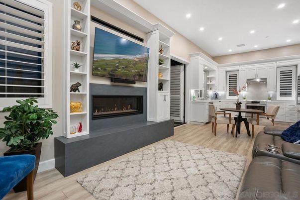Dining room, Fireplace, Interior, Kitchen, Living room, Recessed Lighting, Wood Texture Flooring