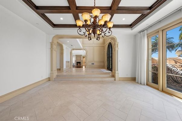 Chandelier, Empty room, Fireplace, Interior, Recessed Lighting, Wooden Beams