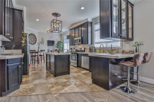Chandelier, Dining room, Interior, Kitchen, Pendant Lights, Recessed Lighting, Stainless Steel Appliances, Tile Countertops