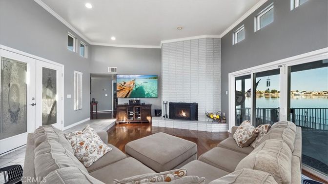 Fireplace, Interior, Living room, Recessed Lighting, Water, Wood Texture Flooring