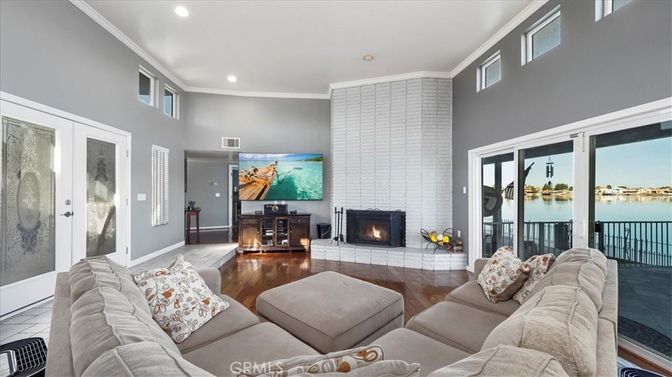 Fireplace, Interior, Living room, Recessed Lighting, Water, Wood Texture Flooring