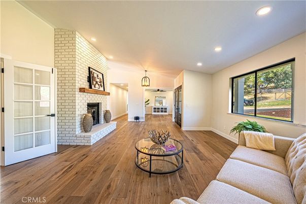 Fireplace, Interior, Living room, Pendant Lights, Recessed Lighting, Stone Walls, Wood Texture Flooring