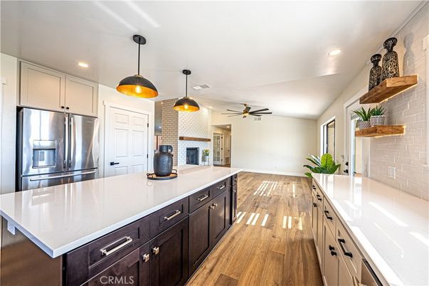 Interior, Kitchen, Pendant Lights, Recessed Lighting, Stainless Steel Appliances, Stone Walls, Wood Texture Flooring