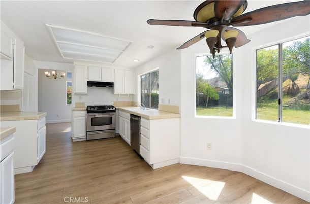 Chandelier, Interior, Kitchen, Recessed Lighting, Stainless Steel Appliances, Wood Texture Flooring