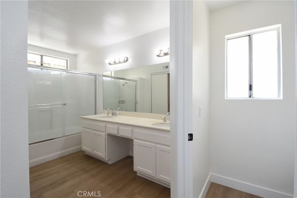 Bathroom, Dual Sink Vanities, Glass Shower, Interior, Wood Texture Flooring