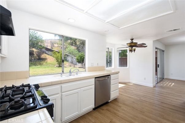 Interior, Kitchen, Recessed Lighting, Tile Countertops, Wood Texture Flooring
