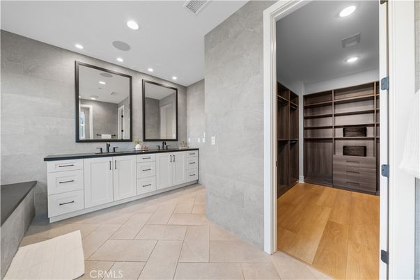 Bathroom, Dual Sink Vanities, Interior, Recessed Lighting, Walk-in Closets, Wood Texture Flooring