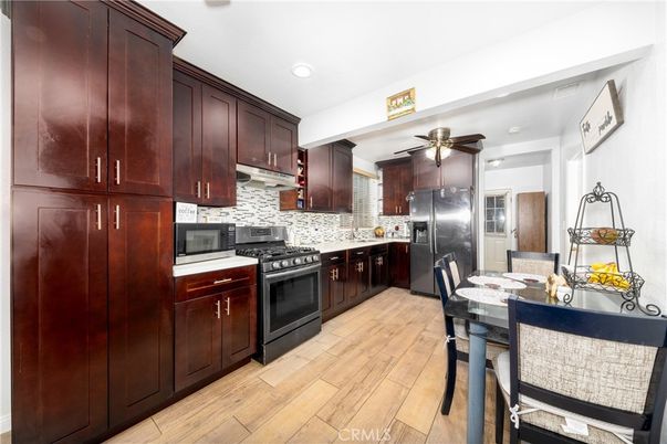 Dining room, Interior, Kitchen, Recessed Lighting, Stainless Steel Appliances, Wood Texture Flooring