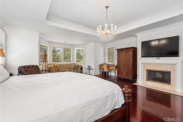 Bedroom, Chandelier, Dining room, Fireplace, Interior, Wood Texture Flooring