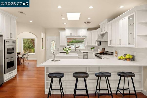 Interior, Kitchen, Recessed Lighting, Stainless Steel Appliances, Wood Texture Flooring