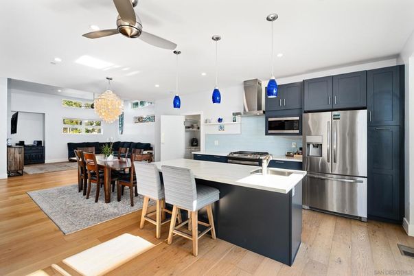 Chandelier, Dining room, Interior, Kitchen, Pendant Lights, Recessed Lighting, Stainless Steel Appliances, Wood Texture Flooring