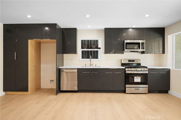 Interior, Kitchen, Recessed Lighting, Stainless Steel Appliances, Wood Texture Flooring