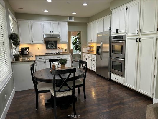 Dining room, Interior, Kitchen, Recessed Lighting, Stainless Steel Appliances, Wood Texture Flooring