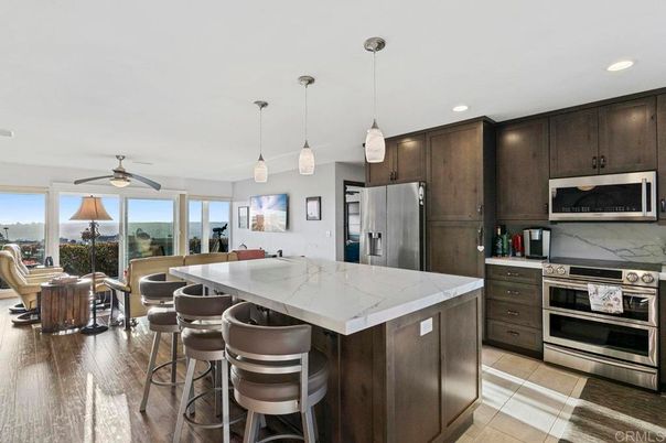 Dining room, Interior, Kitchen, Pendant Lights, Recessed Lighting, Stainless Steel Appliances, Wood Texture Flooring