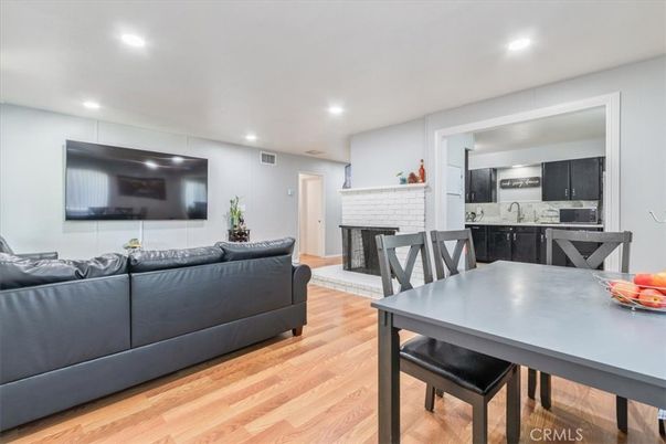 Dining room, Fireplace, Interior, Kitchen, Living room, Recessed Lighting, Wood Texture Flooring