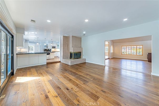 Empty room, Fireplace, Interior, Kitchen, Pendant Lights, Recessed Lighting, Wood Texture Flooring