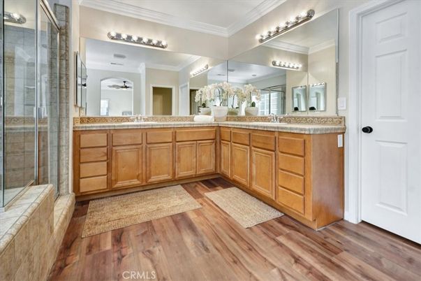 Bathroom, Dual Sink Vanities, Glass Shower, Interior, Tile Countertops, Wood Texture Flooring