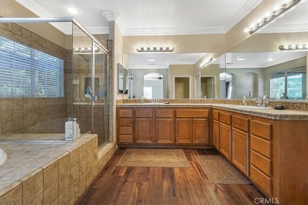 Bathroom, Dual Sink Vanities, Glass Shower, Interior, Recessed Lighting, Tile Countertops, Wood Texture Flooring