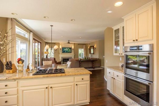 Dining room, Fireplace, Interior, Kitchen, Living room, Pendant Lights, Recessed Lighting, Stainless Steel Appliances, Wood Texture Flooring