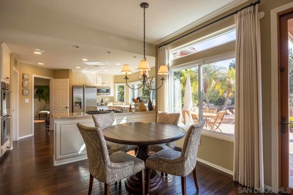 Chandelier, Dining room, Interior, Kitchen, Recessed Lighting, Stainless Steel Appliances, Wood Texture Flooring