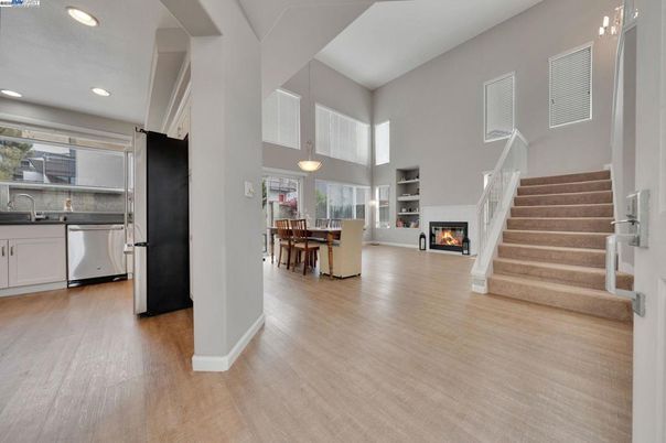 Dining room, Fireplace, Interior, Kitchen, Pendant Lights, Recessed Lighting, Stainless Steel Appliances, Wood Texture Flooring