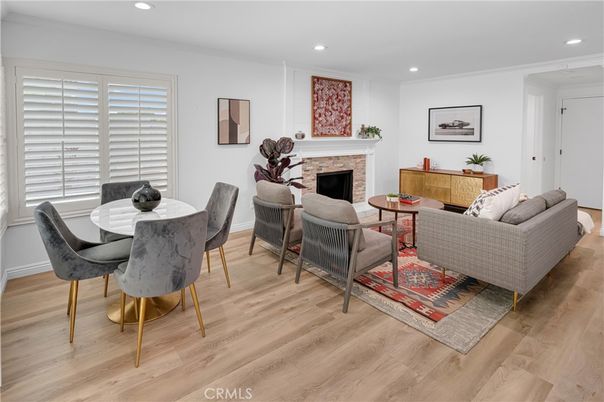 Dining room, Fireplace, Interior, Living room, Recessed Lighting, Wood Texture Flooring