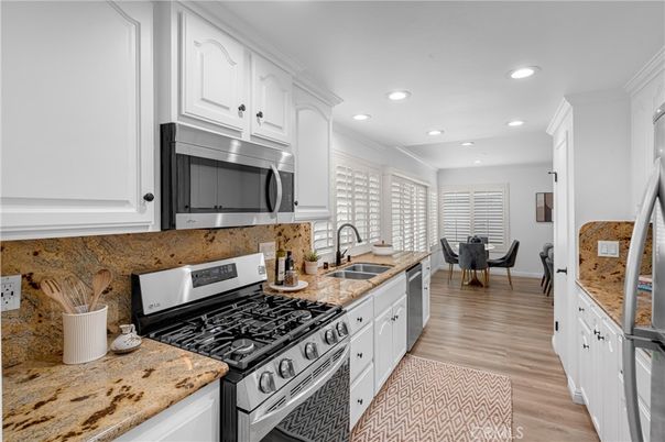 Dining room, Interior, Kitchen, Recessed Lighting, Stainless Steel Appliances, Wood Texture Flooring