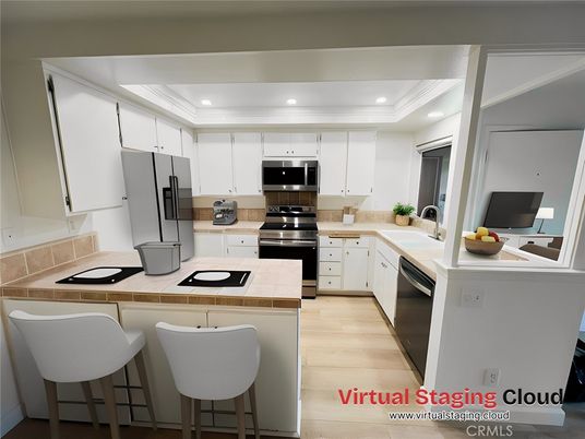 Interior, Kitchen, Recessed Lighting, Stainless Steel Appliances, Tile Countertops, Wood Texture Flooring