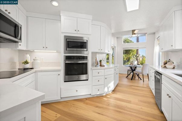 Dining room, Interior, Kitchen, Recessed Lighting, Stainless Steel Appliances, Wood Texture Flooring