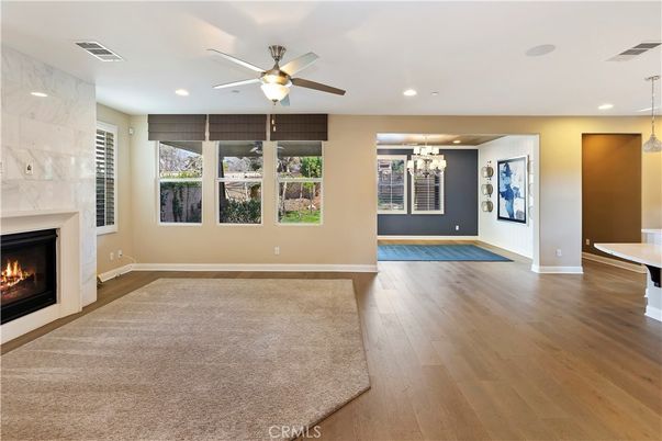 Empty room, Fireplace, Interior, Marble Walls, Pendant Lights, Recessed Lighting, Wood Texture Flooring