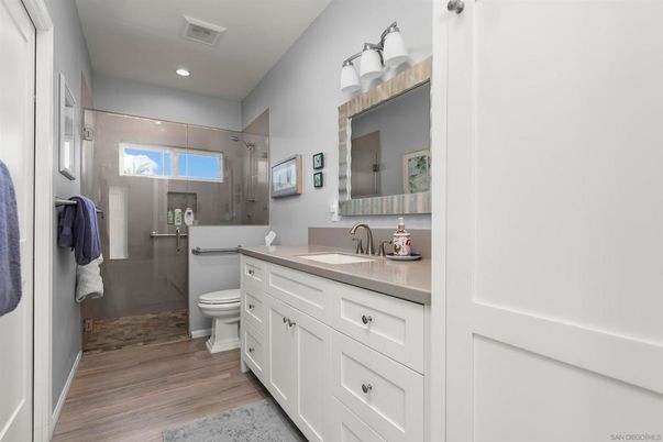 Bathroom, Dual Sink Vanities, Interior, Recessed Lighting, Wood Texture Flooring
