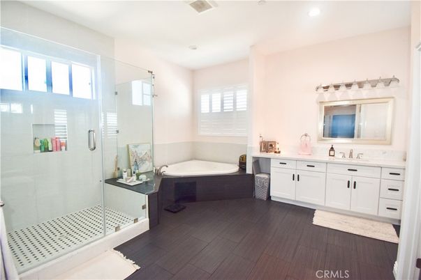 Bathroom, Dual Sink Vanities, Glass Shower, Interior, Recessed Lighting, Wood Texture Flooring