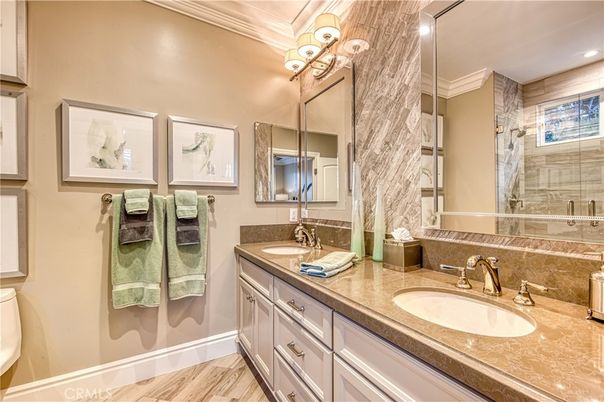 Bathroom, Dual Sink Vanities, Glass Shower, Interior, Recessed Lighting, Wood Texture Flooring