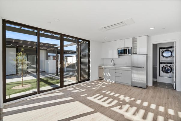 Interior, Kitchen, Recessed Lighting, Stainless Steel Appliances, Washer, Wood Texture Flooring