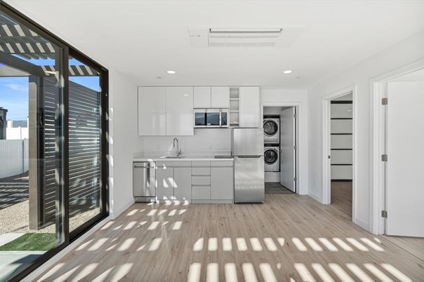 Interior, Kitchen, Recessed Lighting, Stainless Steel Appliances, Washer, Wood Texture Flooring