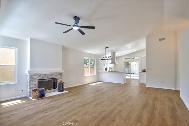 Empty room, Fireplace, Interior, Kitchen, Pendant Lights, Recessed Lighting, Wood Texture Flooring