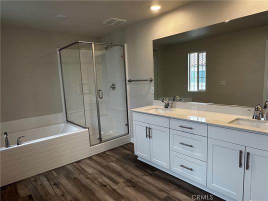 Bathroom, Dual Sink Vanities, Glass Shower, Interior, Recessed Lighting, Wood Texture Flooring
