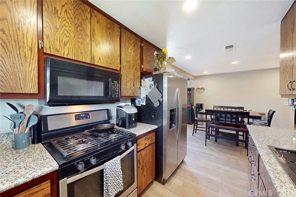 Dining room, Interior, Kitchen, Recessed Lighting, Stainless Steel Appliances, Wood Texture Flooring