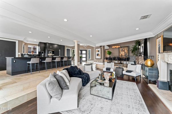 Dining room, Fireplace, Interior, Kitchen, Living room, Recessed Lighting, Stainless Steel Appliances, Wood Texture Flooring