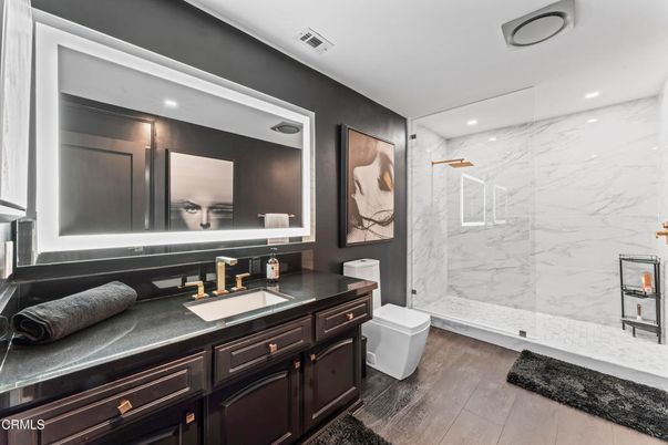 Bathroom, Glass Shower, Interior, Marble Walls, Recessed Lighting, Wood Texture Flooring