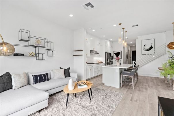 Dining room, Interior, Kitchen, Living room, Pendant Lights, Recessed Lighting, Stainless Steel Appliances, Wood Texture Flooring