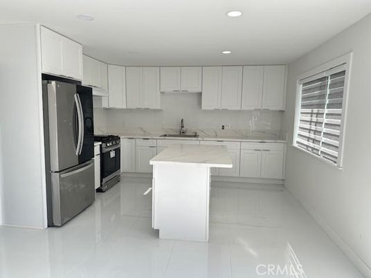Interior, Kitchen, Marble Walls, Recessed Lighting, Stainless Steel Appliances